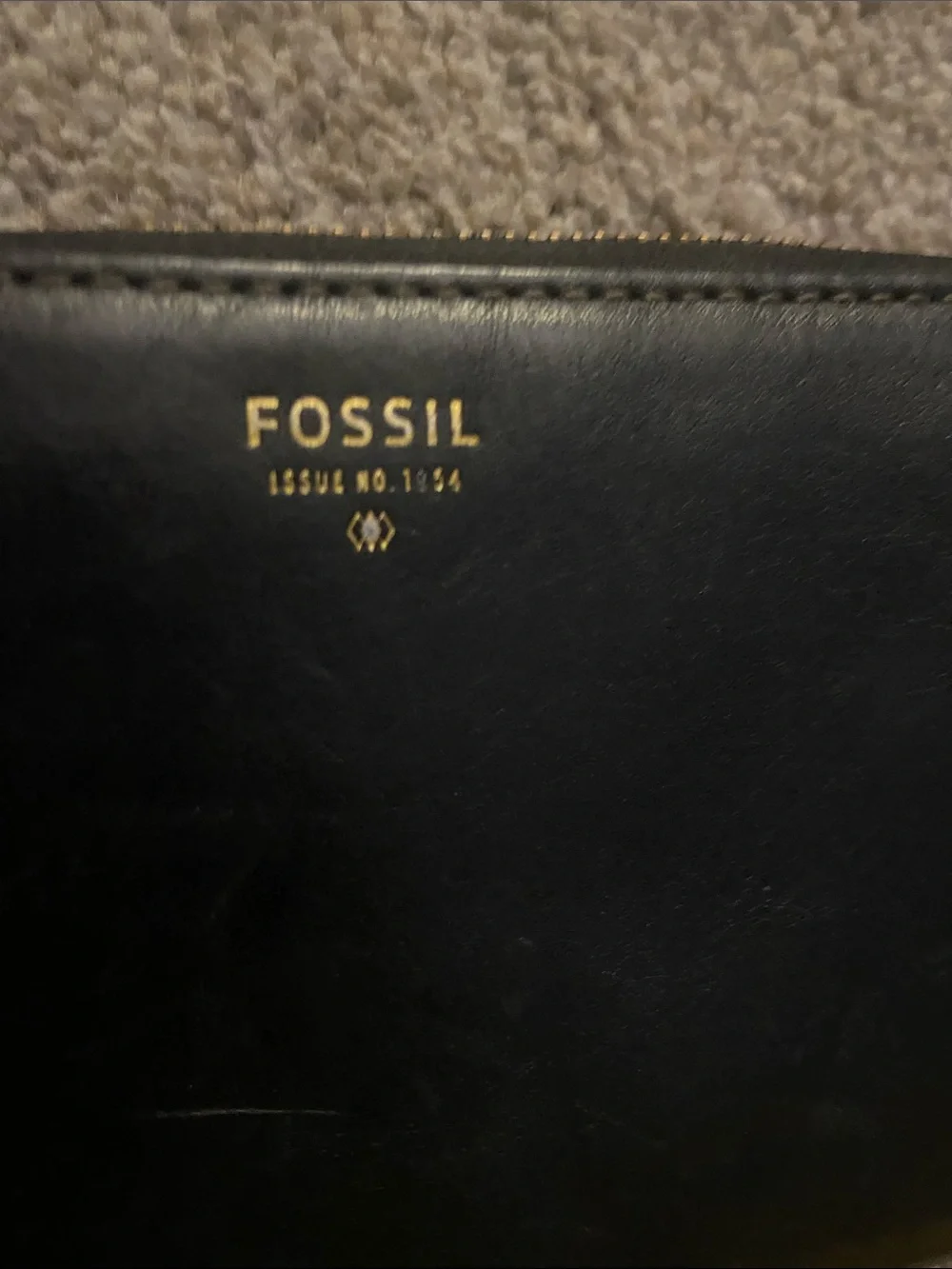 Fossil Black Leather Zip Wristlet with Gold Accent, gently used lots of life.